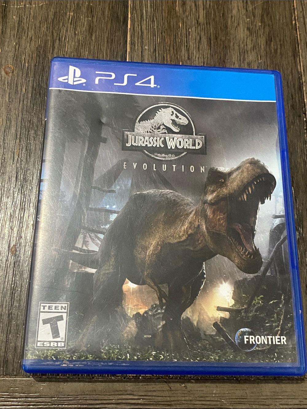 Sony PS4 Jurassic World Evolution - Blue Case with Black Cover Art
